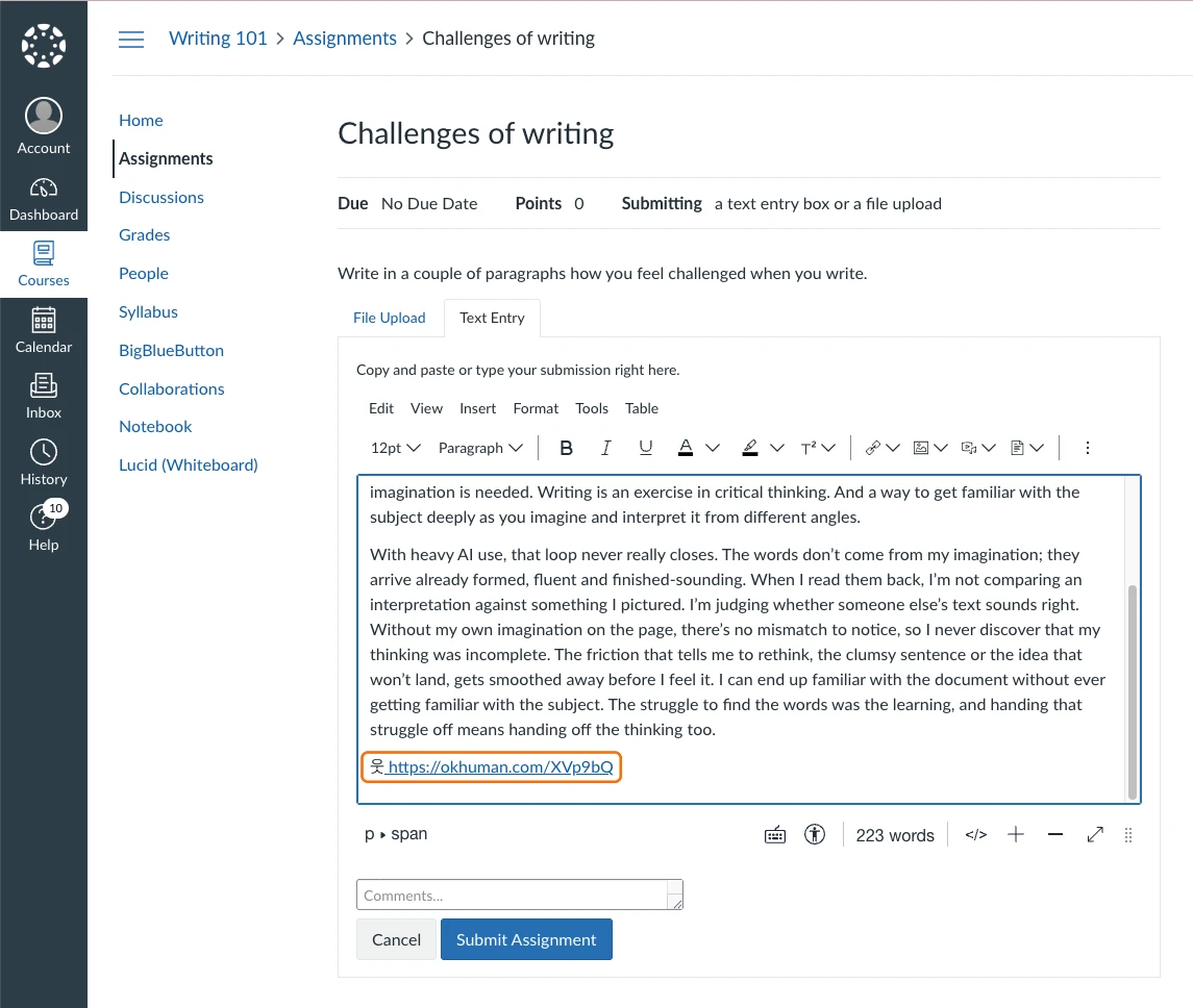 A Canvas assignment's Text Entry box with the stamped essay pasted in, its 웃 stamp link at the end outlined in orange, above the Submit Assignment button